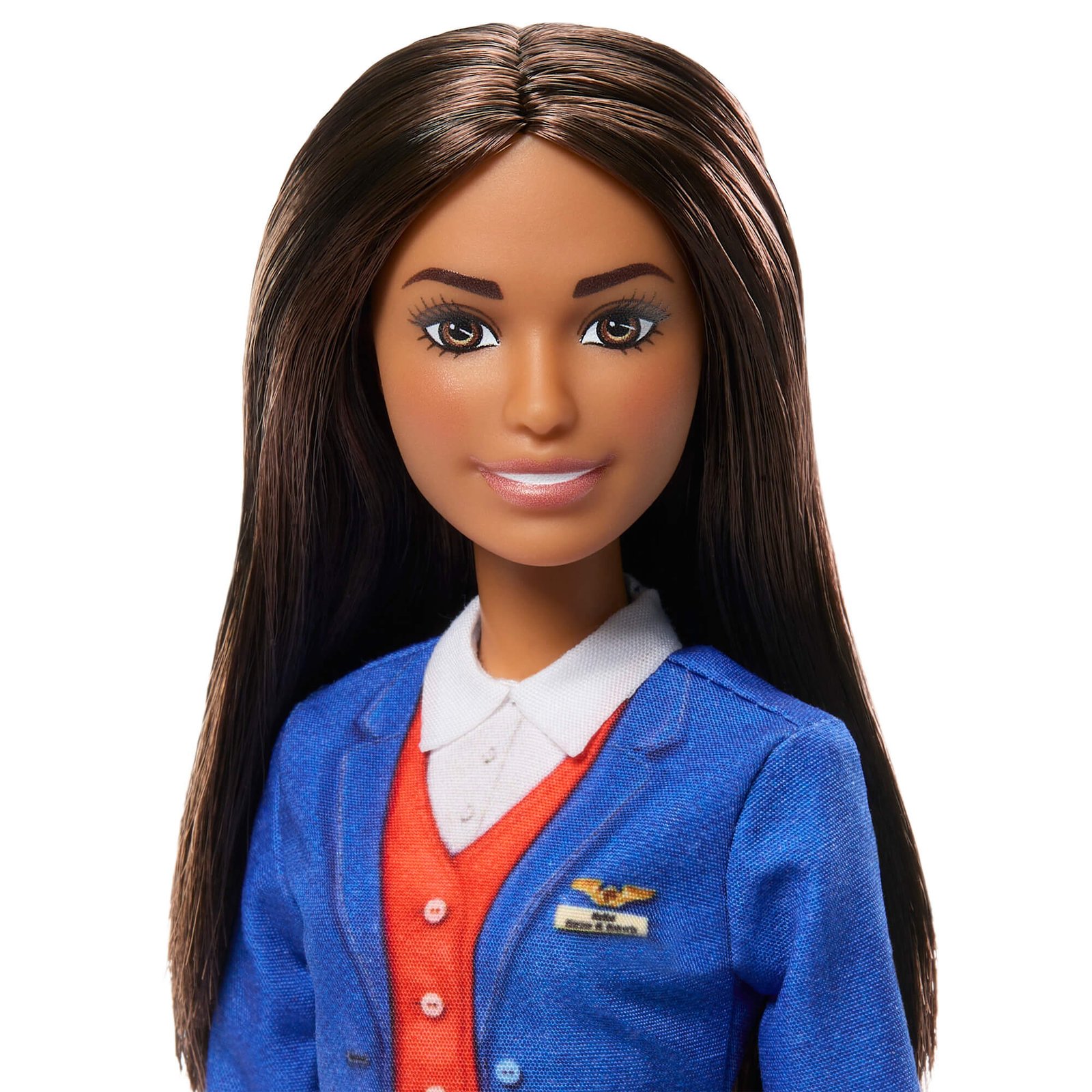 Tamsiaplaukė Barbie – sparnelių ženklelis ant mėlyno švarkelio ir raudona liemenė