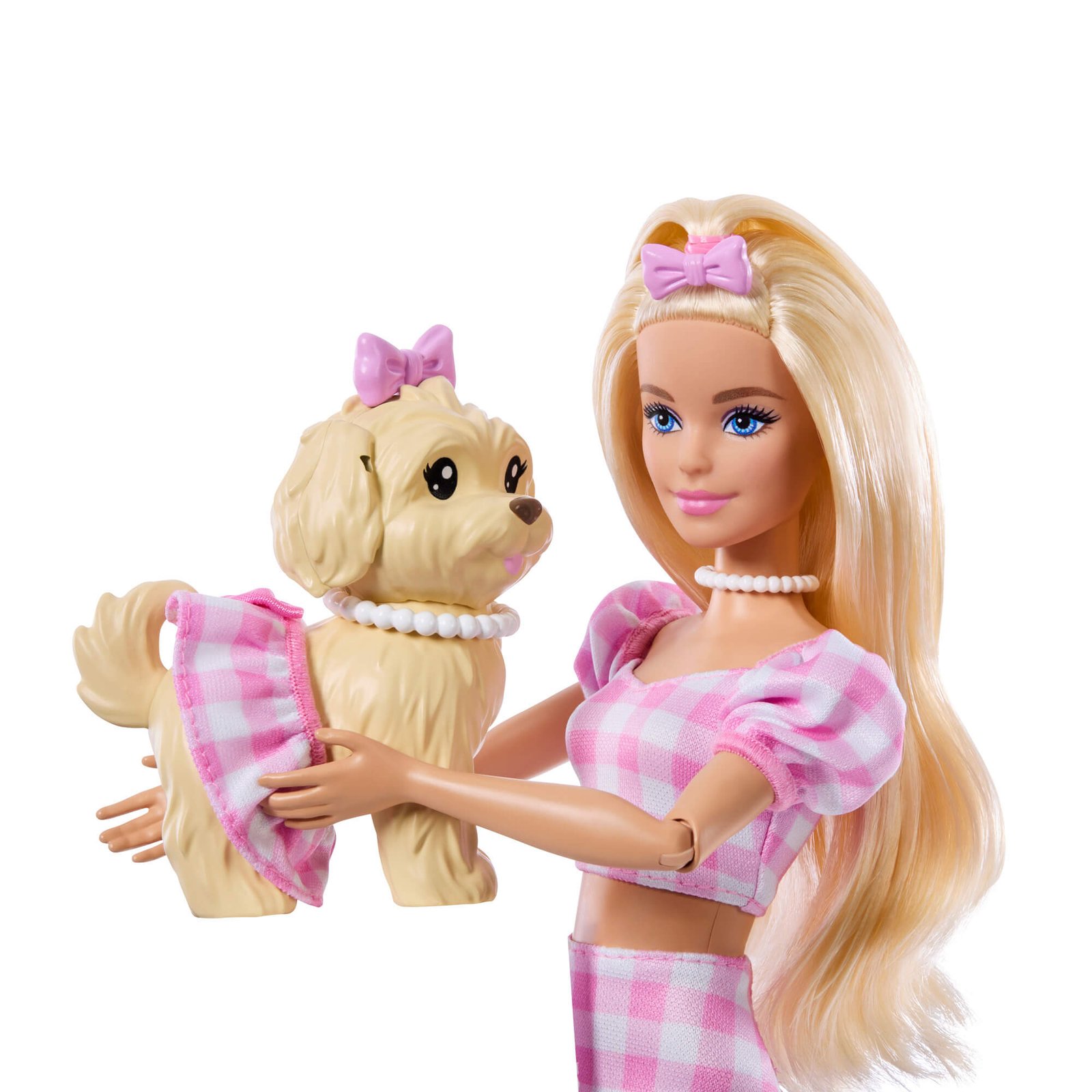 Barbie laiko ant rankų šuniuką rožinių langelių sijonėliu