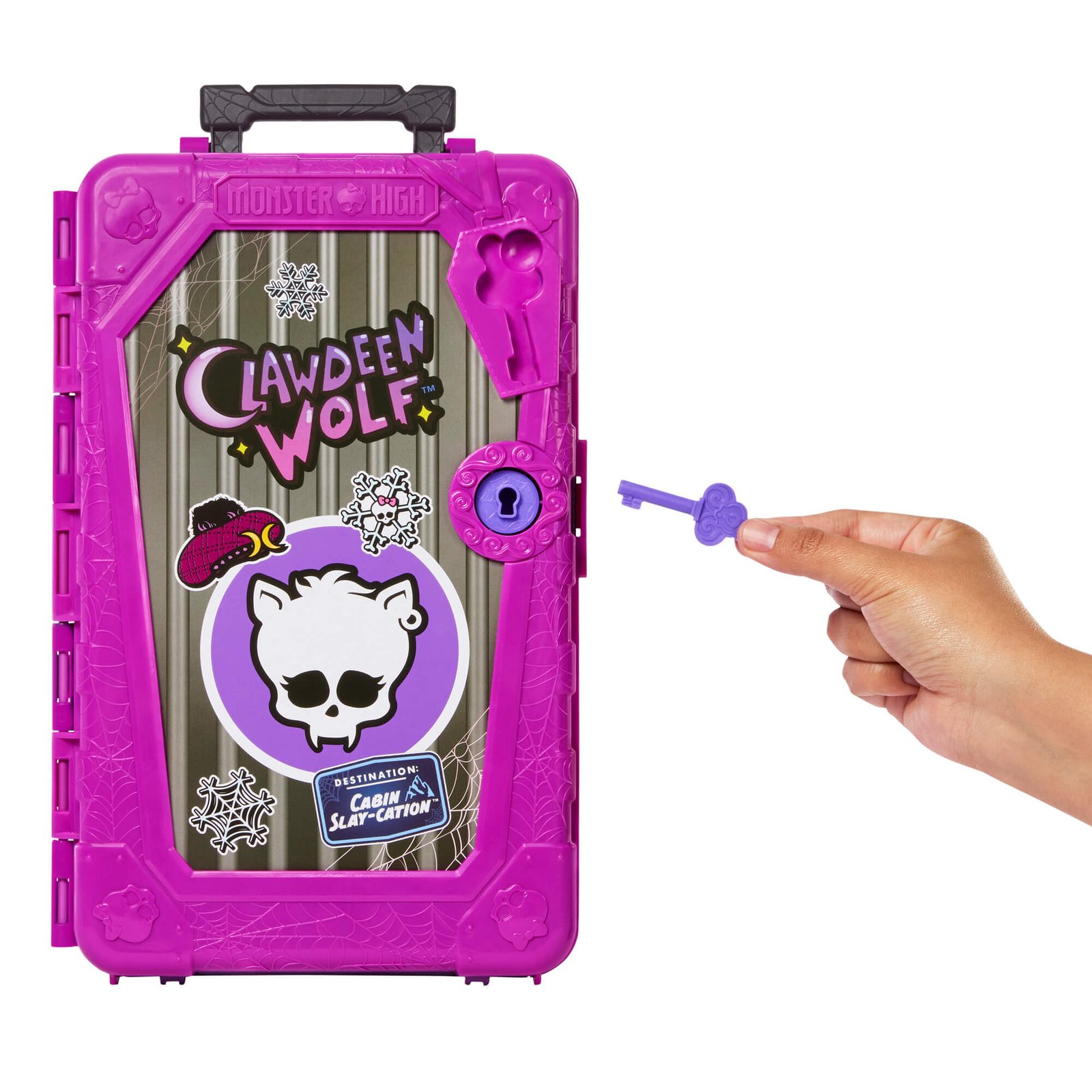 Violetinis raktas rankoje prie purpurinio lagamino spynos
